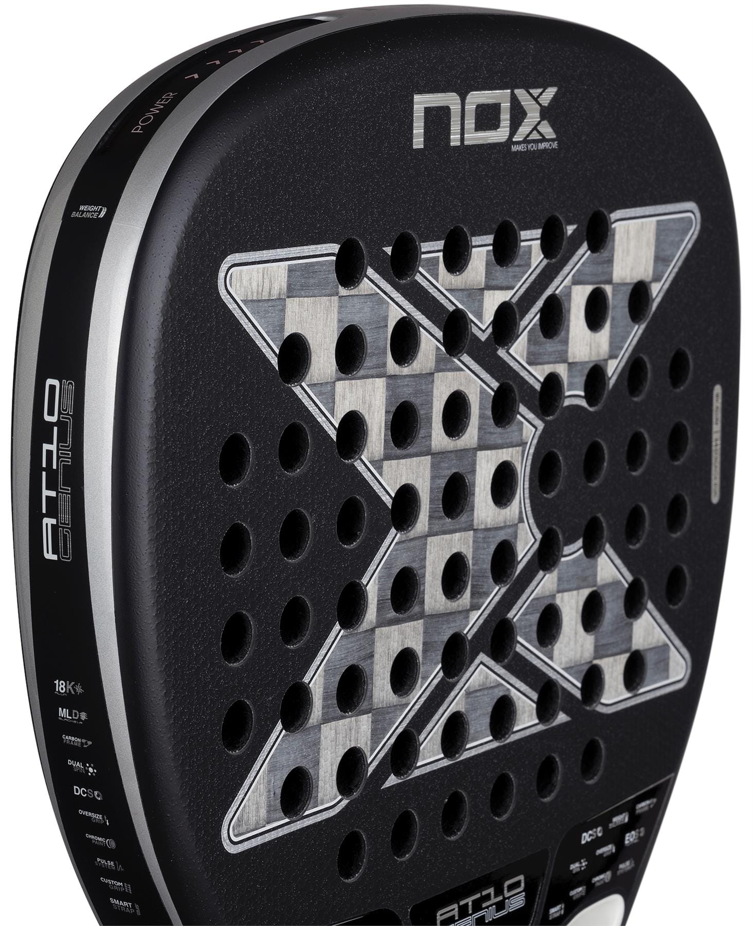 Close-up of the NOX Luxury AT10 Genius Attack 18K Alum By Agustin Tapia 2026 padel racket, with a checkered center, X-shaped holes, and textured black surface in aluminised carbon. Brand and model names are prominently displayed.