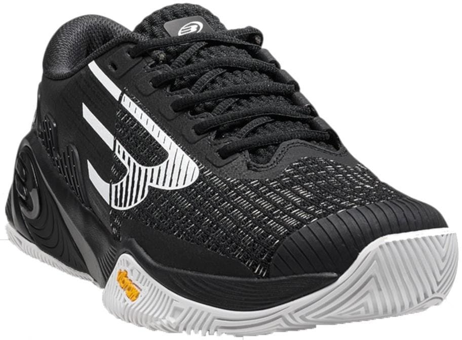 The Bullpadel Vertex Vibram 26V Mens Padel Shoes in black feature white accents, a textured wavy Vibram outsole with yellow details, a large white logo on the upper, and intricate stitching for athletic style and performance.