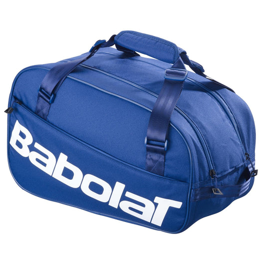 The Babolat Court S Padel Racket Bag - Dark Blue features black straps and a large white Babolat logo on the side, making it a stylish choice for carrying your padel gear.