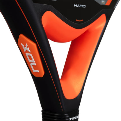 Close-up of the NOX Equation Hard Advanced 2026 Padel Racket, focusing on the handle and textured frame labeled "HARD," featuring an anti-vibration system by NOX for enhanced comfort.