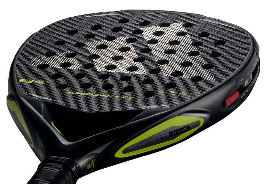 Close-up of the adidas Arrow Hit 2026 Padel Racket with yellow highlights, textured surface, circular holes, and bold logo. Its intelligent balance system delivers powerful padel shots every time.