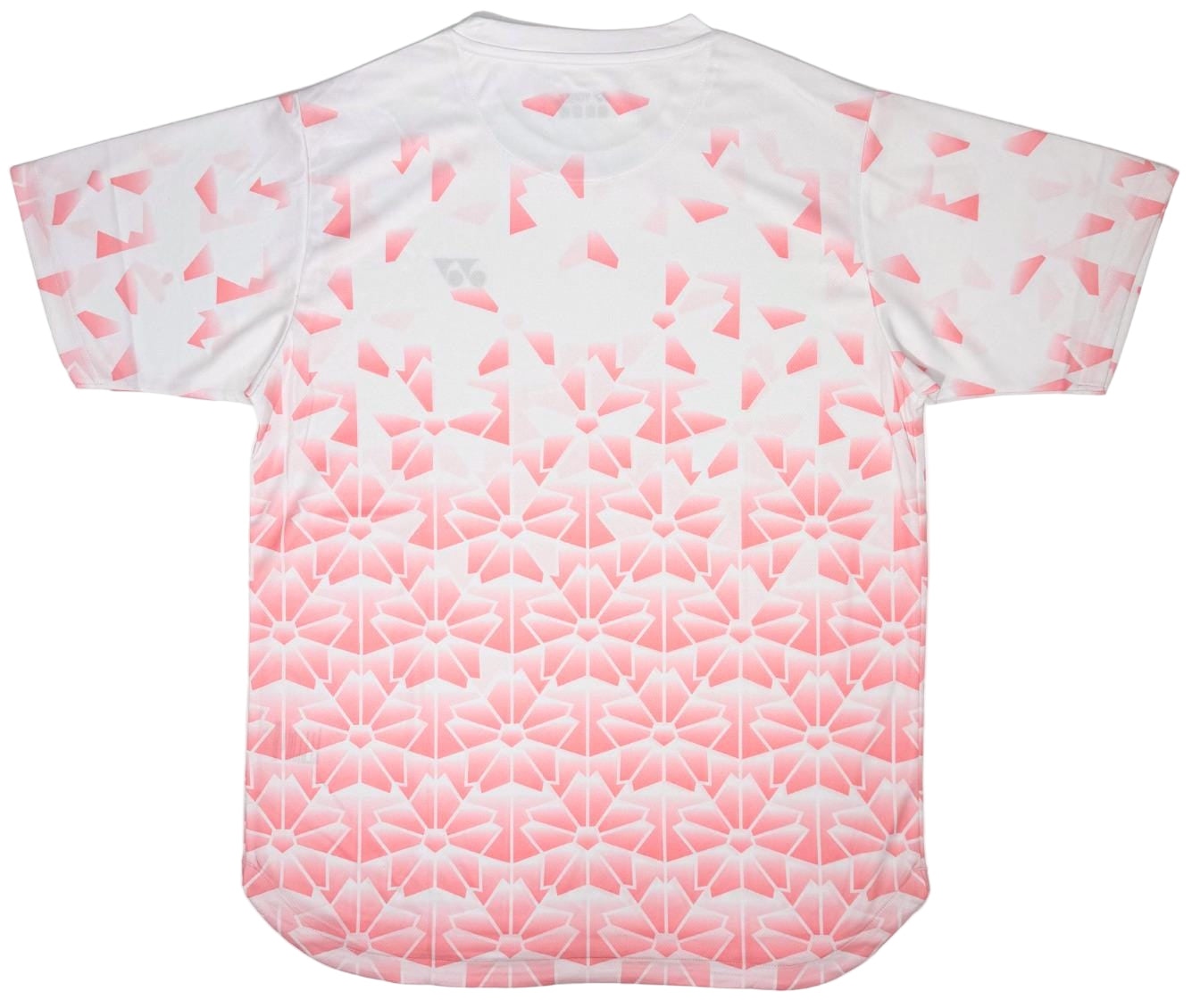The Yonex YTM2025B Mens Padel T-Shirt in white features a gradient pink geometric pattern with star-like shapes, offering quick-dry comfort and stylish performance for the court.