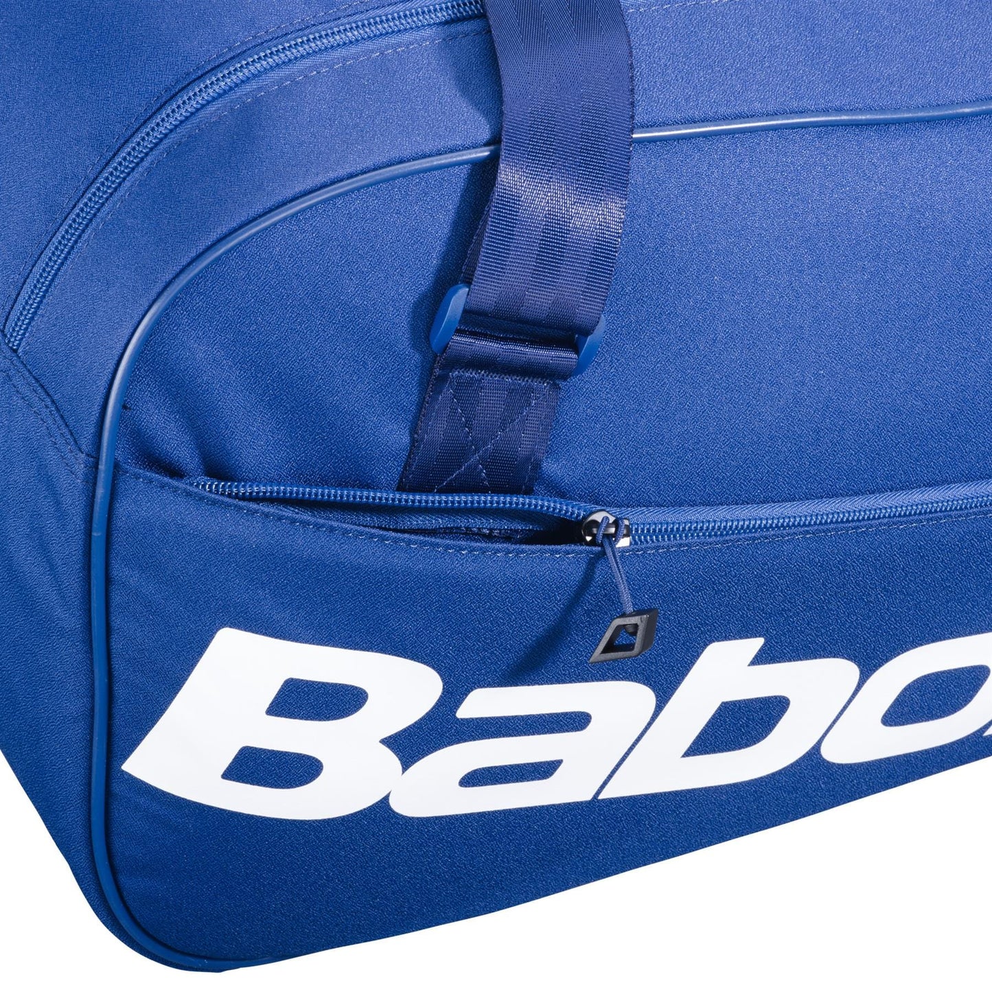 Close-up of the Babolat Court S Padel Racket Bag - Dark Blue, featuring a front zipper pocket and bold white "Babo" branding. A blue strap is partially visible above the pocket, ideal for carrying your padel equipment.