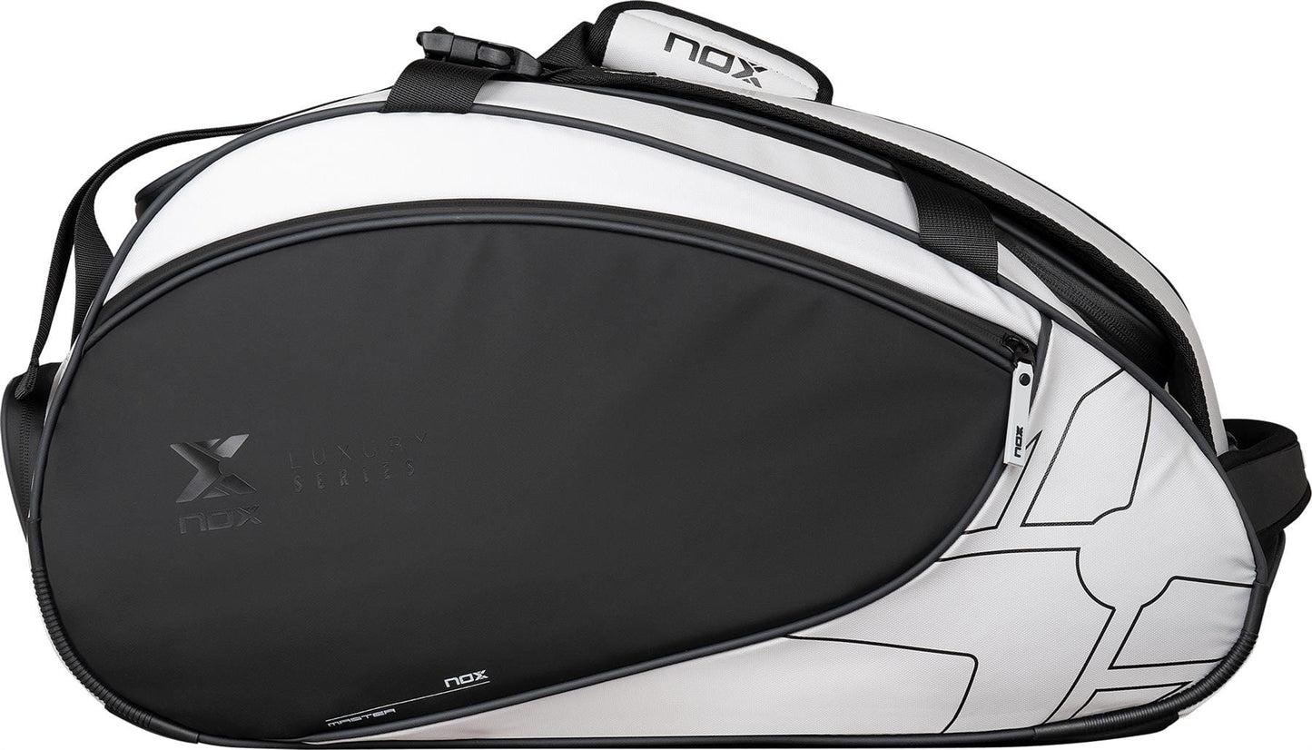 The NOX Luxury Master Series Padel Racket Bag in black and white features a geometric design, zipper closure, and adjustable shoulder strap—ideal for padel players seeking style and functionality.