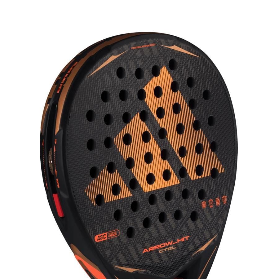Close-up of the adidas Arrow Hit CTRL 2026 Padel Racket with an orange geometric design, round holes, "ARROW-HIT" and "STEEL" text, and an intelligent balance system for precise court control.