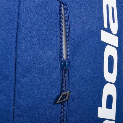 Close-up of the Babolat Court Lite Padel Backpack - Dark Blue, featuring a partially open zippered pocket and visible white Babolat logo, showcasing its practical racket compartment design.