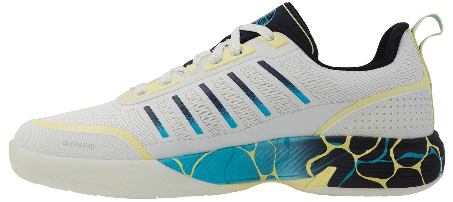 The K-Swiss Ultra Court Men's Padel Shoes in Bit Of Blue/Sanyo Navy/Sanyo Blue feature a cushioned midsole, breathable mesh upper, black and yellow graphic accents, and a supportive heel tab for high-performance on the court.