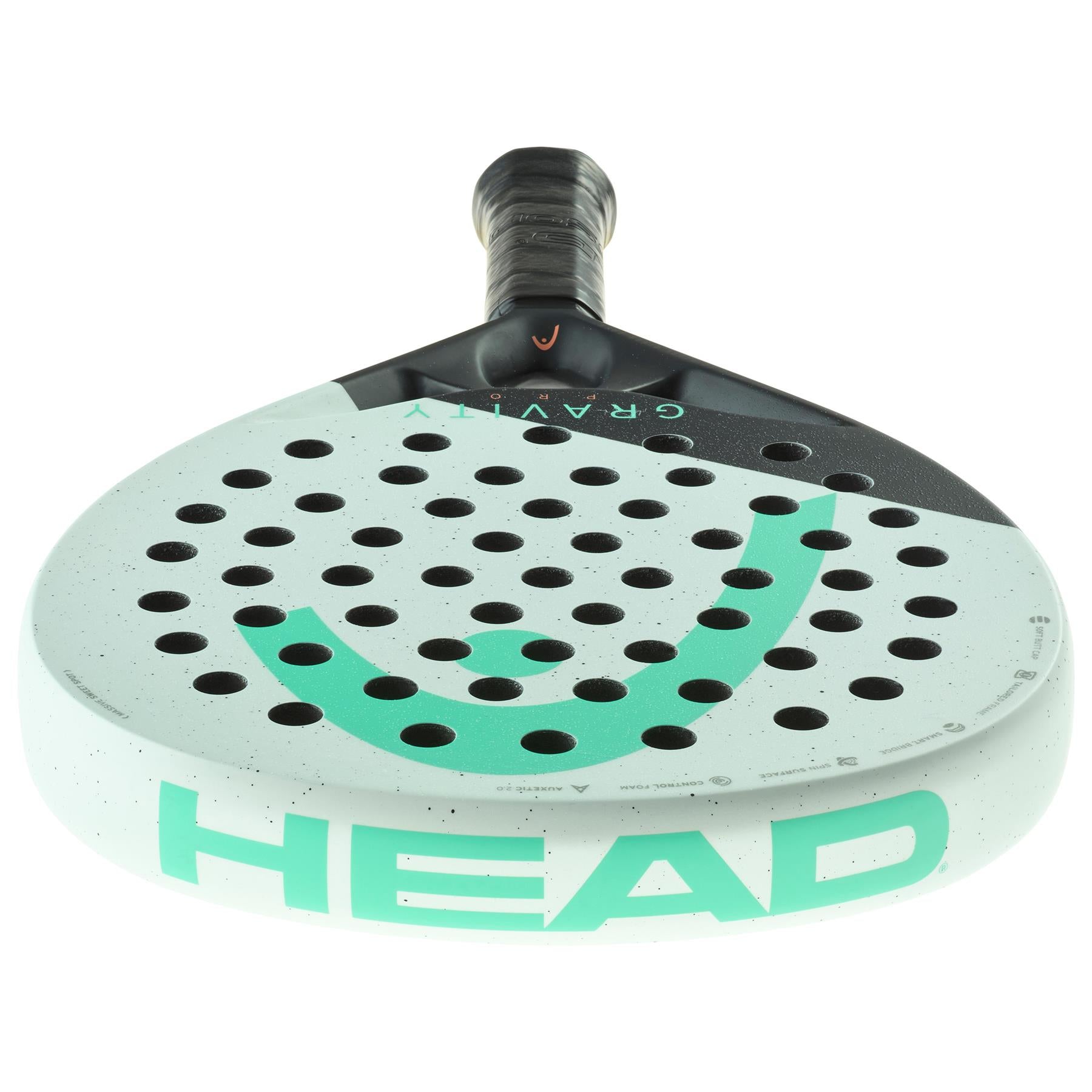 The HEAD Gravity Pro 2024 Padel Racket in mint and black displays the "HEAD" brand name prominently on the front. Its cutting-edge Spin Surface features small circular holes, and the handle is wrapped with grip tape for enhanced control.