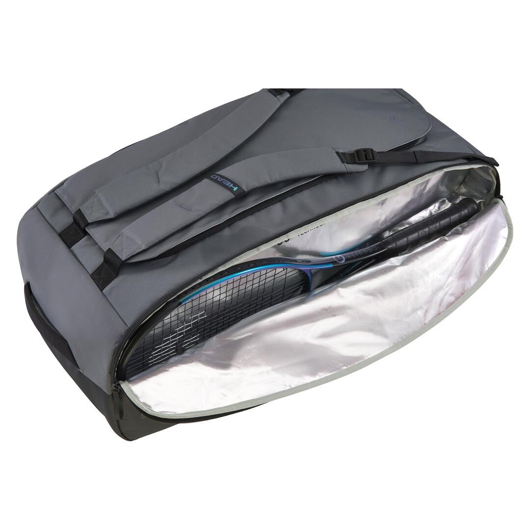 The HEAD Pro X Duffle Padel Bag L in black/dark grey, crafted from recycled PET bottles, showcases climate control tech, a shiny lined interior partially exposed through an open zip revealing a tennis racket, and is designed with sleek black straps.