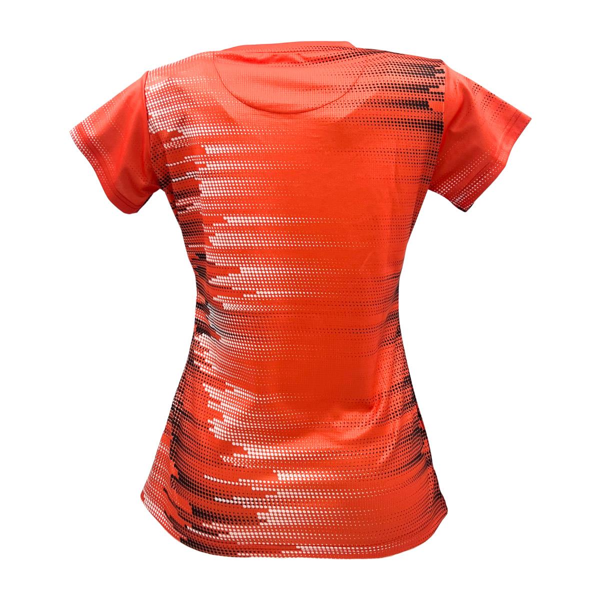 The image shows a Yonex YTL7 Women's Padel T-Shirt in light coral, featuring a red athletic design with a pixelated black-and-white gradient on the back. It has short sleeves, a round neckline, and moisture-wicking technology for a lightweight, form-fitting appeal.