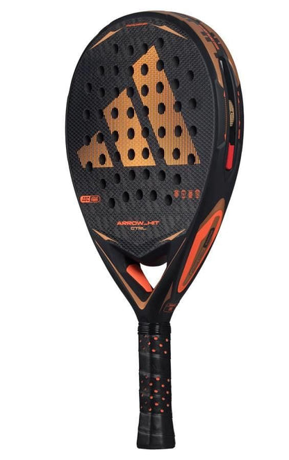 The adidas Arrow Hit CTRL 2026 padel racket features a perforated black and orange face, textured grip, intelligent balance system, and an orange adidas logo on the front.