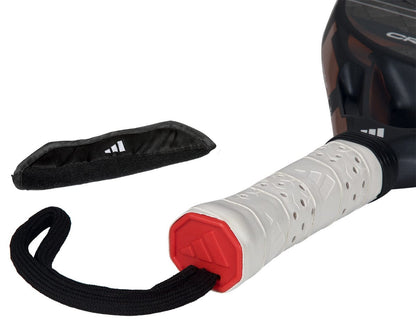 Close-up of the adidas Cross It Ctrl 2026 Padel Racket - Black, featuring a white perforated grip, wrist strap, detached black cover, carbon fibre construction, and Spin Blade Mould tech on a white background.