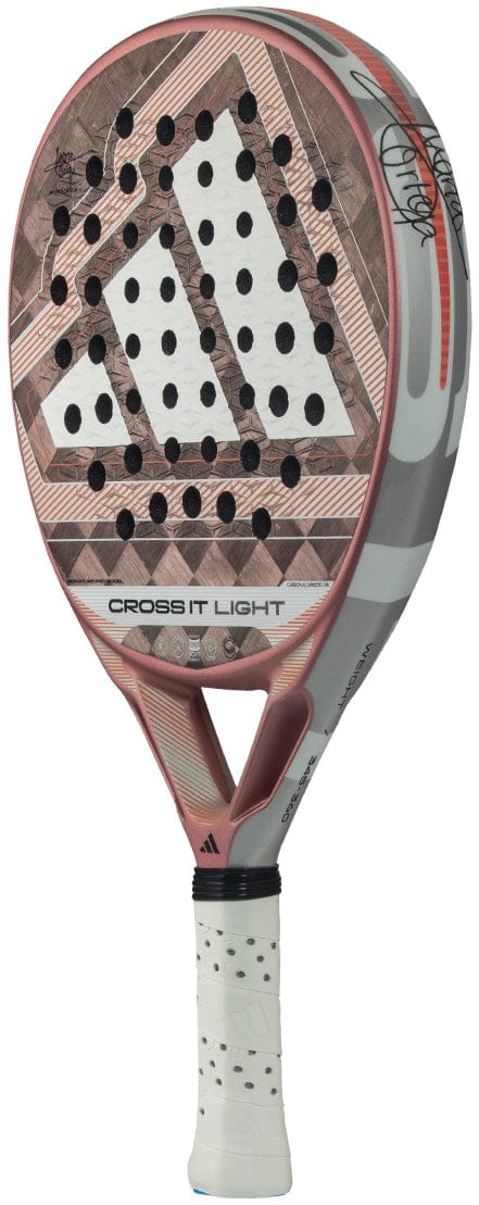 A white and pink adidas Cross It Light 2026 Padel Racket with geometric patterns, black perforations, a white grip, carbon fibre frame, and "CROSS IT LIGHT" text on the side.