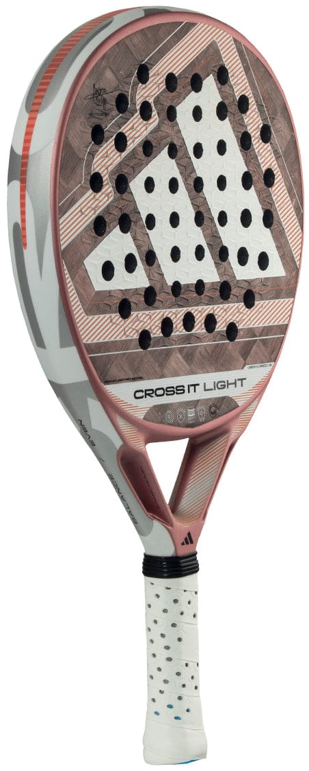 The adidas Cross It Light 2026 Padel Racket features a carbon fibre frame, geometric white and pink design, perforated face, white grip with black dots, and "CROSS IT LIGHT" printed on the side.