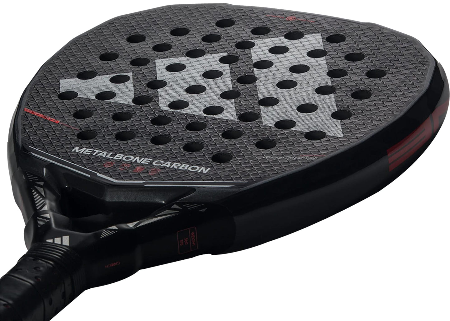 Close-up of the adidas Metalbone Carbon 2026 padel racket for advanced players, featuring a textured round surface and multiple holes. "METALBONE CARBON" appears on the face of this high-performance adidas racket.