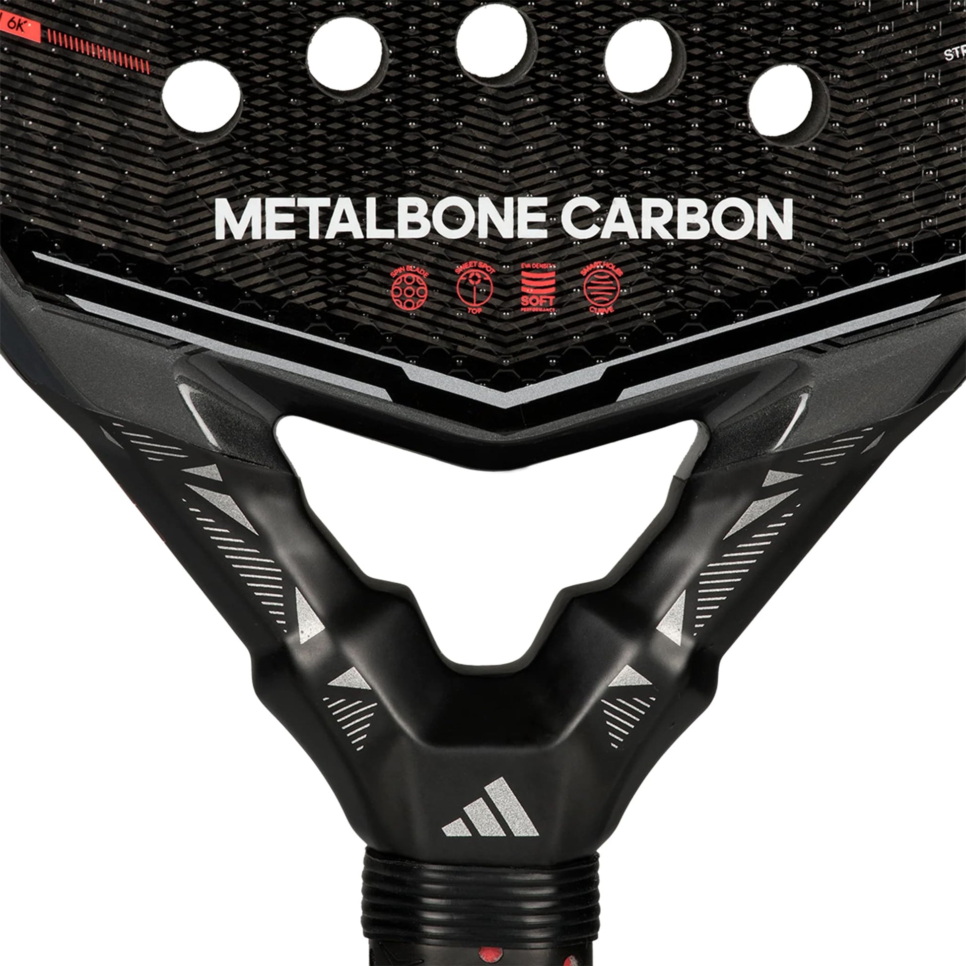 Close-up of the adidas Metalbone Carbon 2026 padel racket for advanced players, with “METALBONE CARBON” on the face, red icons, circular holes, carbon fiber texture, and the adidas logo on the neck.