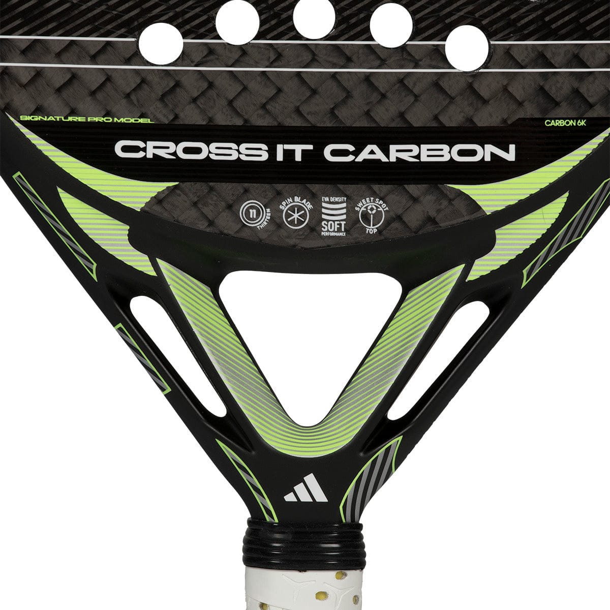 Close-up of the adidas Cross It Carbon 2026 Padel Racket in Black/Green, an advanced carbon fibre racket with a triangular throat, textured surface, and "Cross It Carbon" branding plus technical icons.