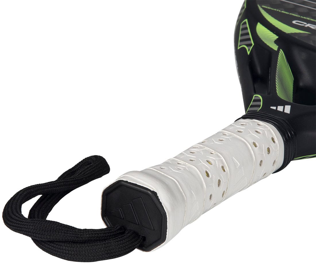 Close-up of the adidas Cross It Carbon 2026 Padel Racket - Black / Green handle, featuring white perforated grip tape and a black wrist strap—engineered for advanced players who want the precision of a carbon fiber padel racket.