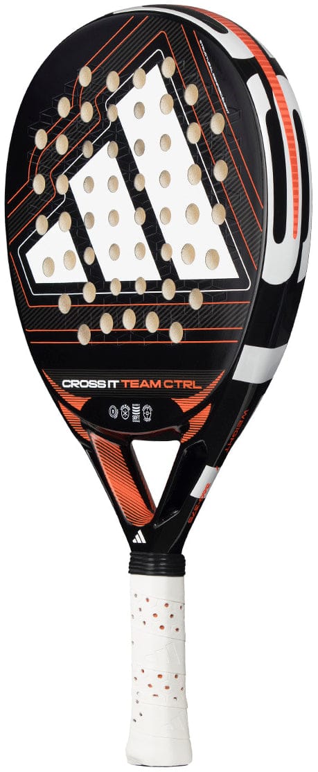 A black and orange adidas Cross It Team Ctrl 2026 Padel Racket featuring a triangular logo, multiple holes on the face, an Extra Power Grip white handle, and "CROSS IT TEAM CTRL" text on the head.