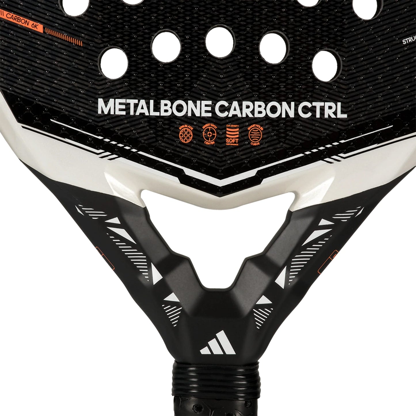 Close-up of the adidas Metalbone Carbon CTRL 2026 padel racket for advanced players, highlighting its textured surface, circular holes, and distinct adidas branding with icons near the handle.
