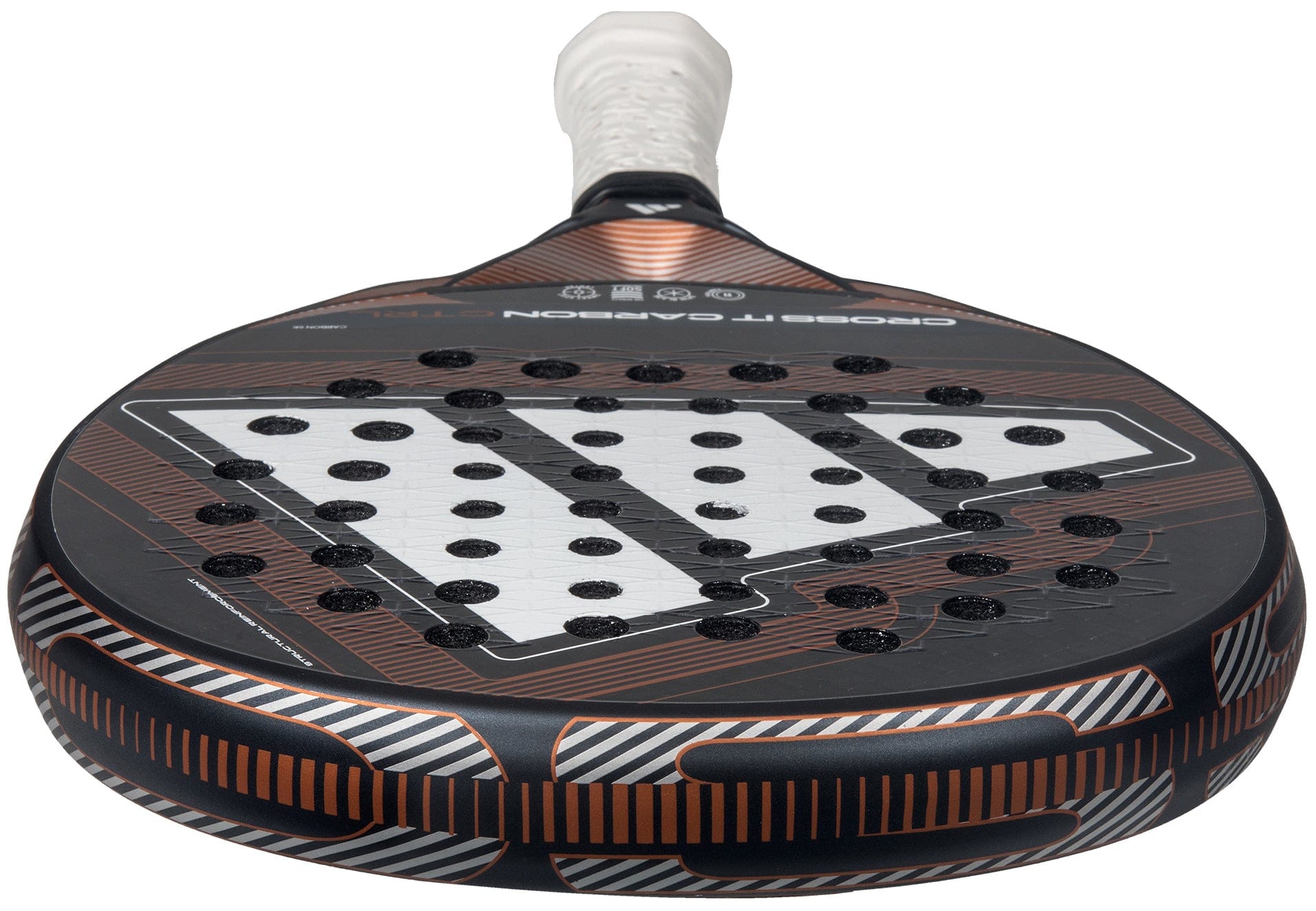 A close-up of the adidas Cross It Carbon Ctrl 2026 Padel Racket - Black, featuring a carbon fibre design with orange accents, white Extra Power Grip, and a distinctive pattern of holes on its face.