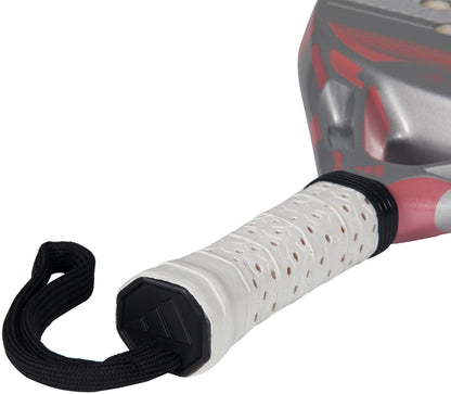 Close-up of the adidas Cross It Team Light 2026 Padel Racket - White/Pink handle, wrapped in a white perforated Extra Power Grip with a black strap; its lightweight head displays bold pink and gray accents.