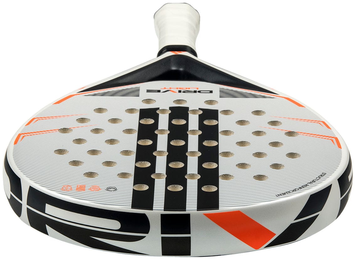 Close-up of the adidas Drive Light 2026 Padel Racket in white and orange, featuring a lightweight design, circular holes on the face, "DRIVE" text near the handle, and a white grip.