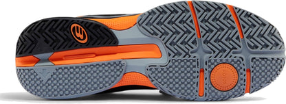 The image shows the sole of Bullpadel Hybrid Fly 26I Mens Padel Shoes - Black, with a grey patterned tread, black and orange accents, textured grips, and a circular element marked “SONIC.”.