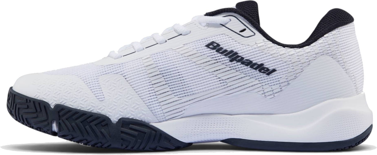 The Bullpadel Hybrid Fly 26I Mens Padel Shoes - White / Navy feature black accents, a hybrid outsole for traction, textured sole, “Bullpadel” in black on the side, and FASTLAB technology.