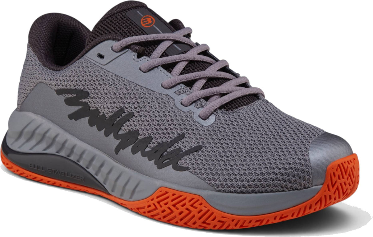 Bullpadel Ionic 26I Mens Padel Shoes - Dark Grey feature an orange sole and toe, black side design, mesh upper, and gray laces—perfect for intermediate and advanced players seeking comfort and performance.