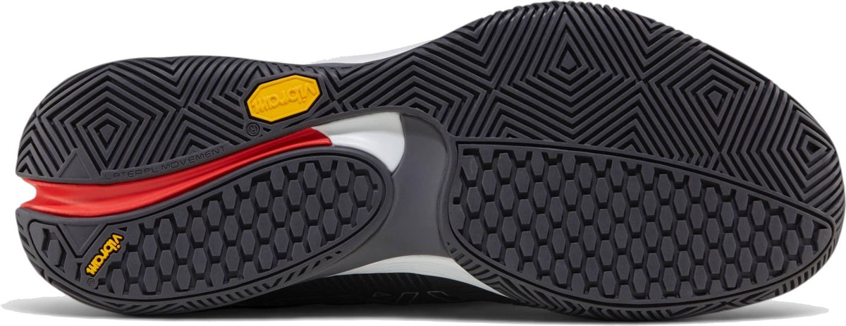 Close-up of the Vibram outsole on the Bullpadel Vertex Vibram 26I Mens Padel Shoes - Asphalt, showing textured black and gray tread with red and yellow accents, designed for superior grip and stability.