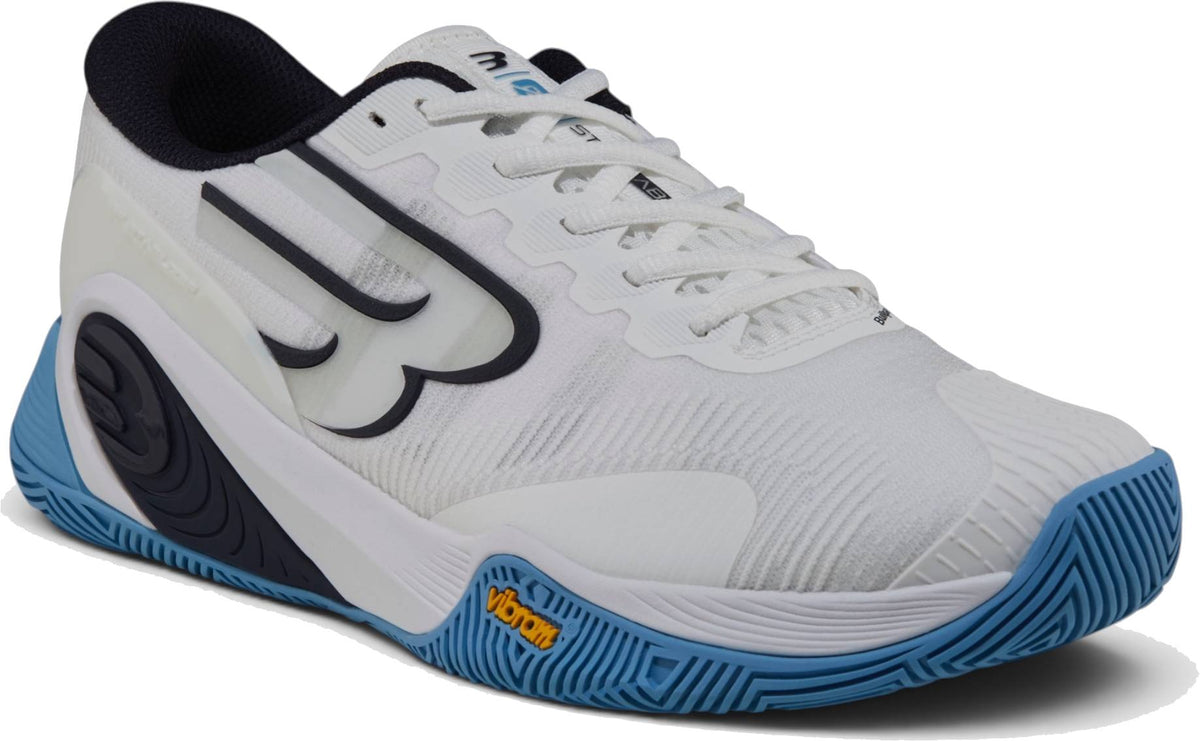 The Bullpadel Vertex Vibram 26I Mens Padel Shoes - Blue features a white mesh upper, blue textured Vibram outsole for grip, black accents, laces, and bold “B” logo—ideal sports or padel footwear from Bullpadel.
