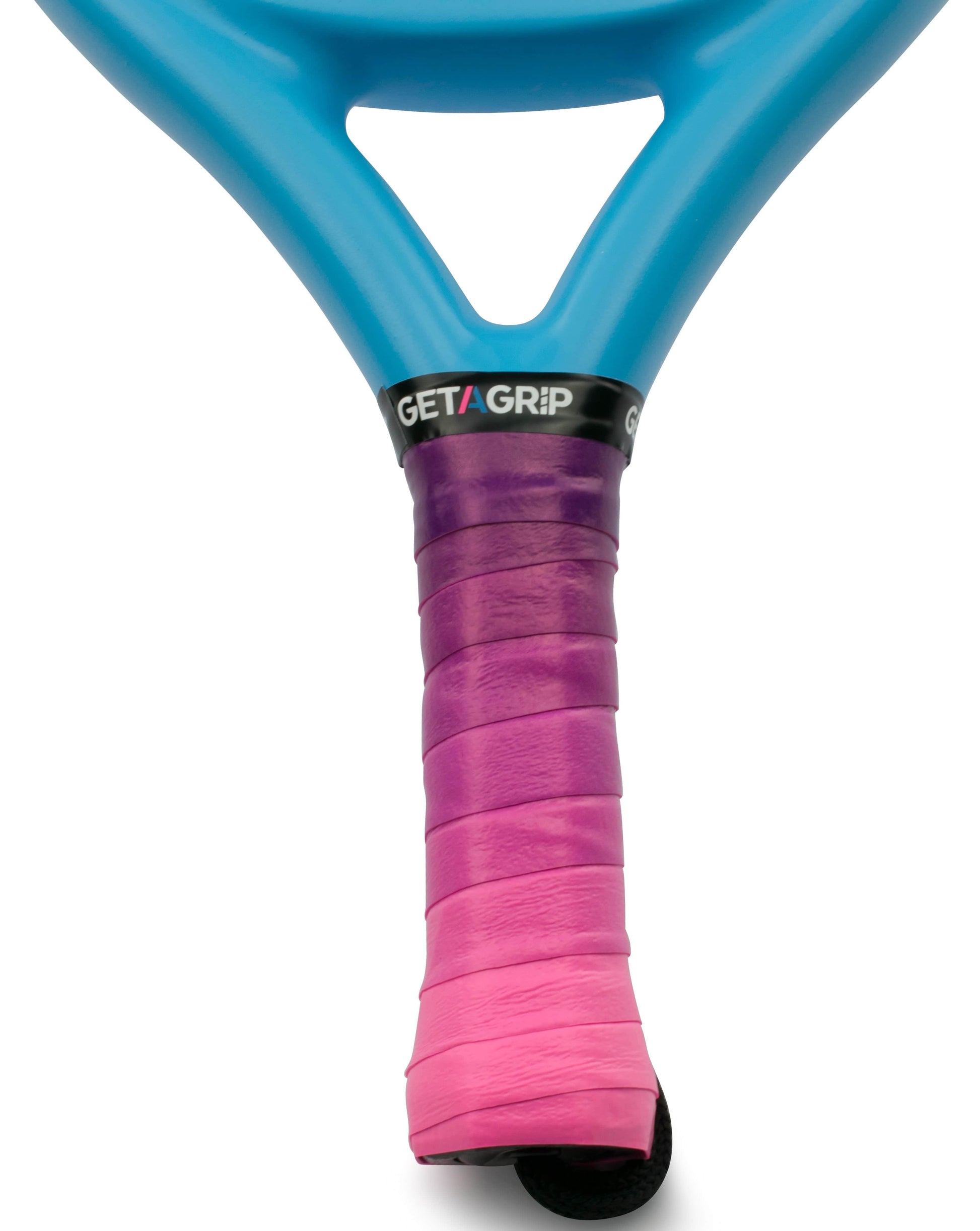 Close-up of the Get A Grip Padel Overgrip - Cascade, featuring a pink-to-purple ombré wrap on a blue racquet handle. The black band at the top displays "GET A GRIP" in white and pink letters, combining style and comfort.