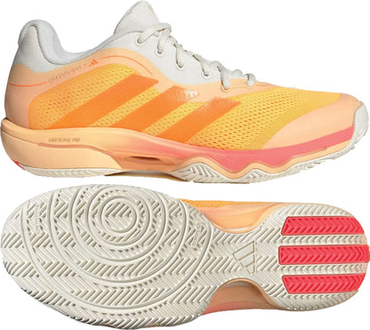 The adidas Crazyflight 7 Indoor Men’s Padel Shoes in Lucid Tangerine, Orange, and Off White feature mesh uppers, three orange stripes, LightstrikePro cushioning, textured rubber soles with circular patterns, and red accents.