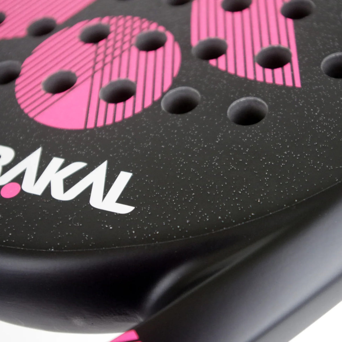 Close-up of the Karakal Air Lite 345 Pink Padel Racket face, featuring a speckled black surface with rows of circular holes and pink patterned accents.