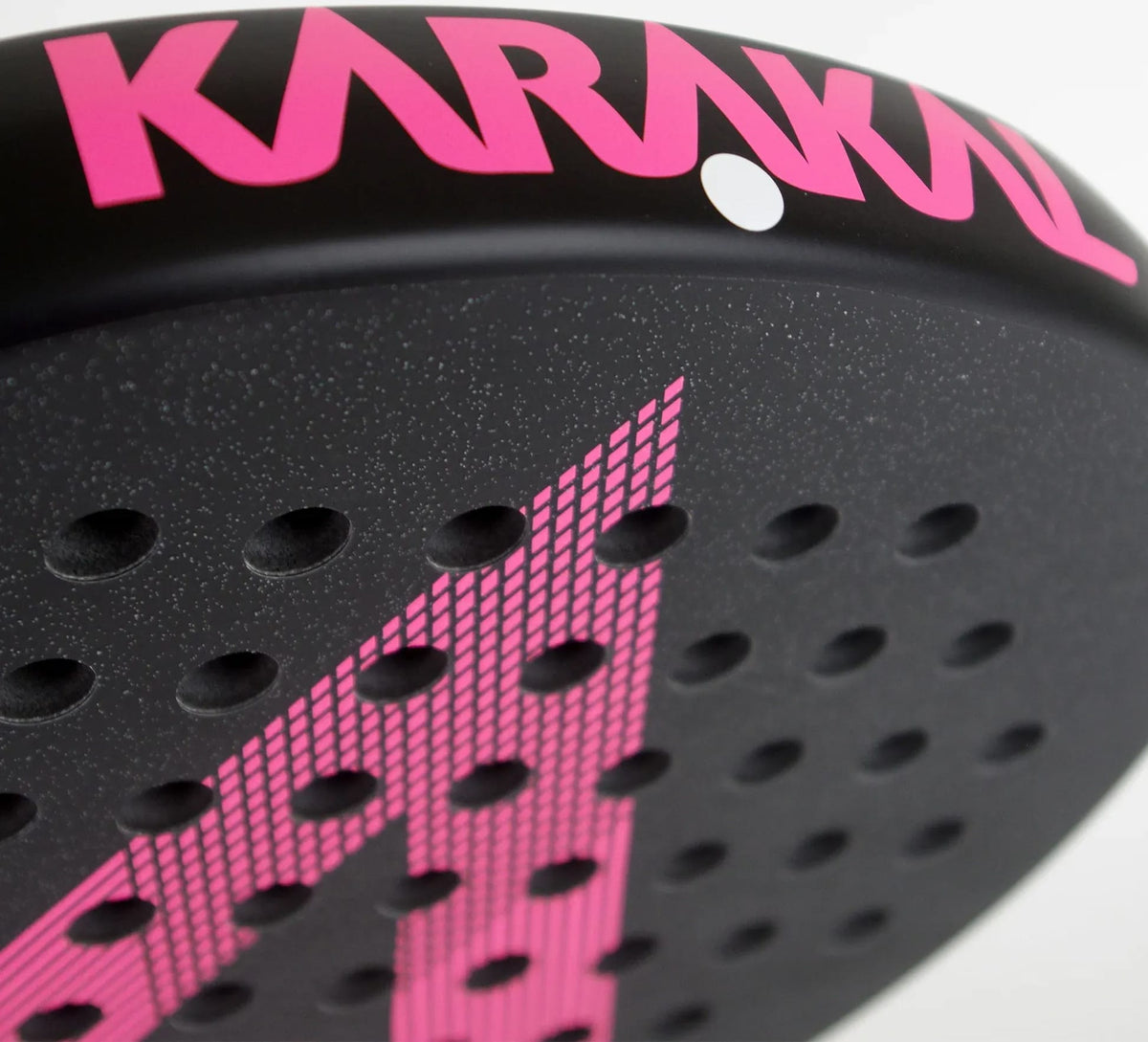 Close-up of a Karakal Air Lite 345 Pink Padel Racket head featuring a geometric grid pattern across its perforated black surface.