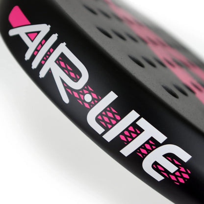 Close-up of a black Karakal Air Lite 345 Pink Padel Racket featuring the text “AIR LITE” in white letters with pink accents and circular perforations on the racket face.