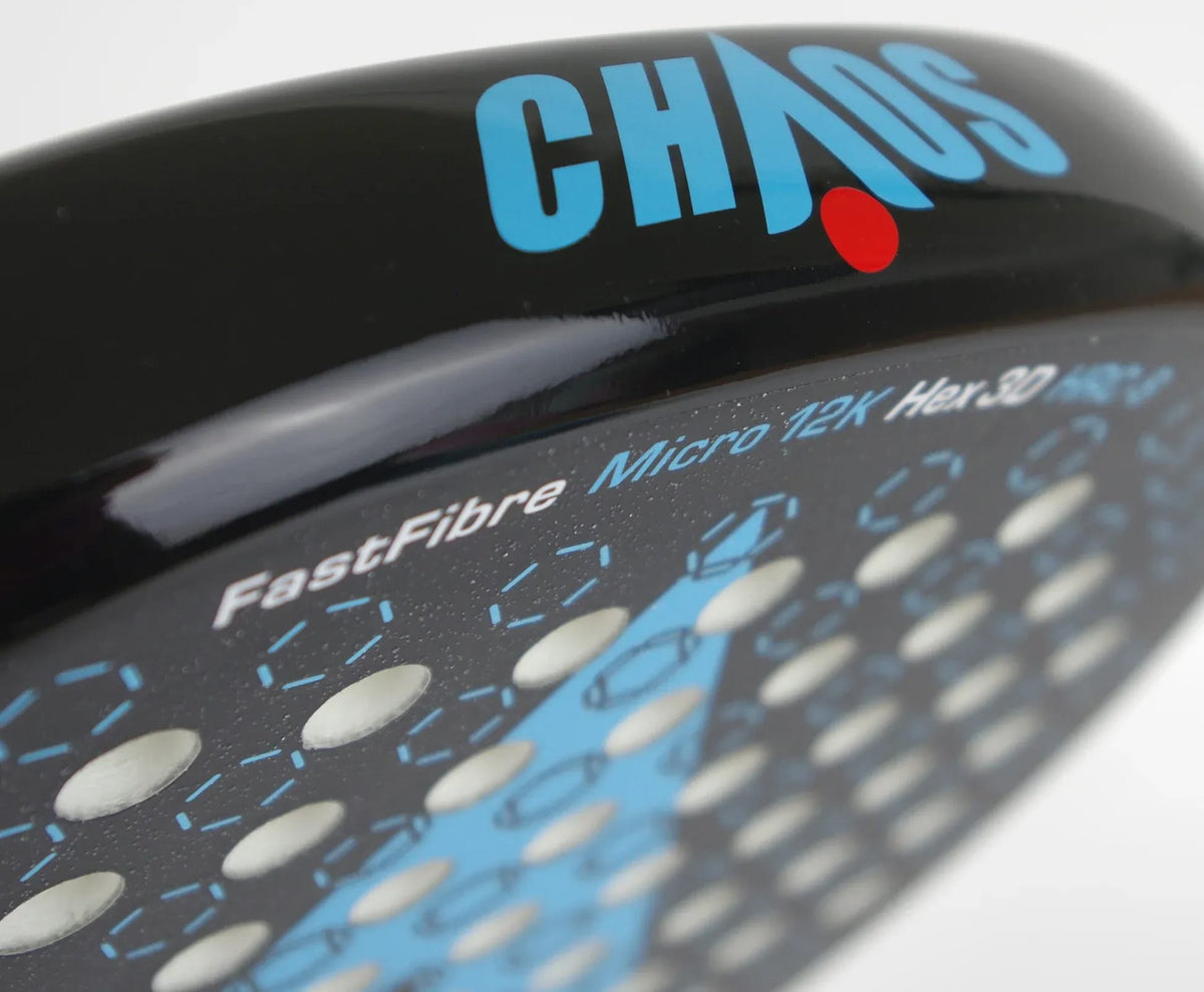 Close-up of a black Karakal Chaos Dynamic 2026 padel racket face, featuring the word “CHAOS” in blue text with a red dot, alongside printed technical specifications including “FastFibre” and “Micro 12K”.
