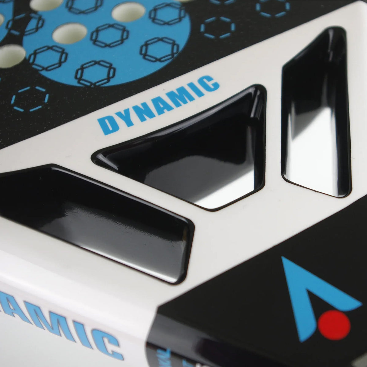Close-up of a Karakal Chaos Dynamic 2026 padel racket featuring white, blue, and black geometric designs with triangular cutouts and the word “DYNAMIC” printed in blue.