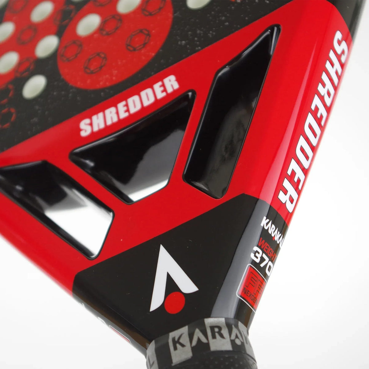 A close-up of a red and black Karakal Chaos Shredder 2026 padel racket, featuring the word “SHREDDER” printed on the frame and surface.