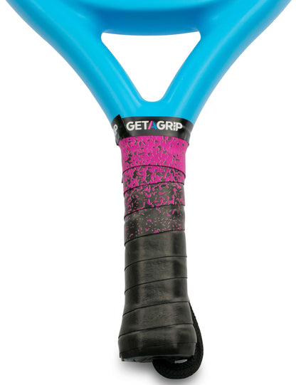 Close-up of a blue tennis racket with a Get A Grip Padel Overgrip - Looking Sharp from Get A Grip, featuring a black and pink splatter design and the phrase "GET A GRIP.