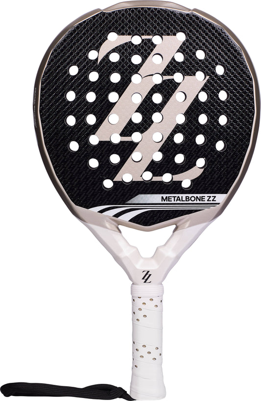 Black and white ADIDAS Metalbone ZZ Team Zinedine Zidane 2026 Padel Racket with a perforated surface featuring a large “ZZ” logo and a white handle with a wrist strap.
