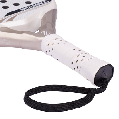 An ADIDAS Metalbone ZZ Carbon Zinedine Zidane 2026 Padel Racket with a white grip, black wrist strap, and a light-colored frame featuring the text “METALBONE ZZ.”.