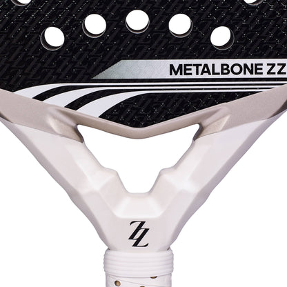 Close-up of the ADIDAS Metalbone ZZ Team Zinedine Zidane 2026 Padel Racket head with a black and white patterned surface, featuring the text “METALBONE ZZ” and a ZZ logo on the white throat.