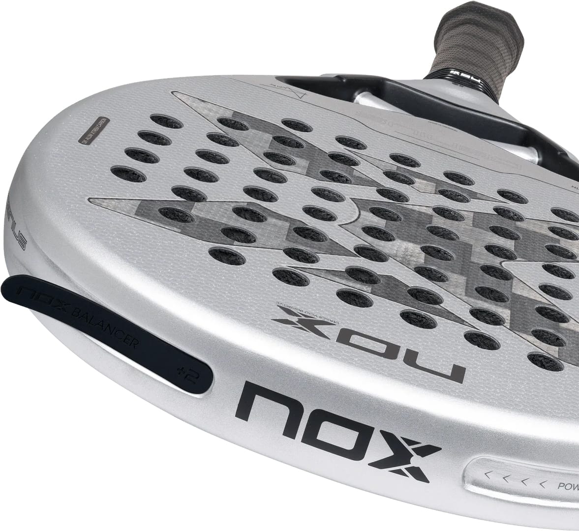 Silver NOX AT10 Genius 12K Alum Xtrem By Agustín Tapia 2027 padel racket with a patterned face, circular perforations, and an adjustable balance weight component on the side.