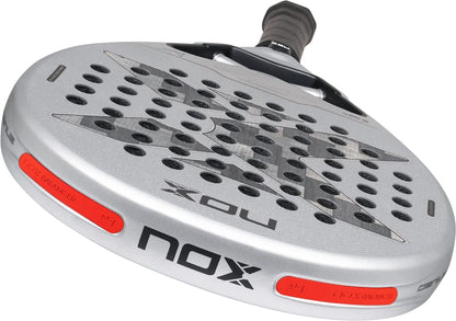 Silver NOX AT10 Genius 12K Alum Xtrem By Agustín Tapia 2027 padel racket with a teardrop head, a black grip, and two red balance weight inserts on the frame.
