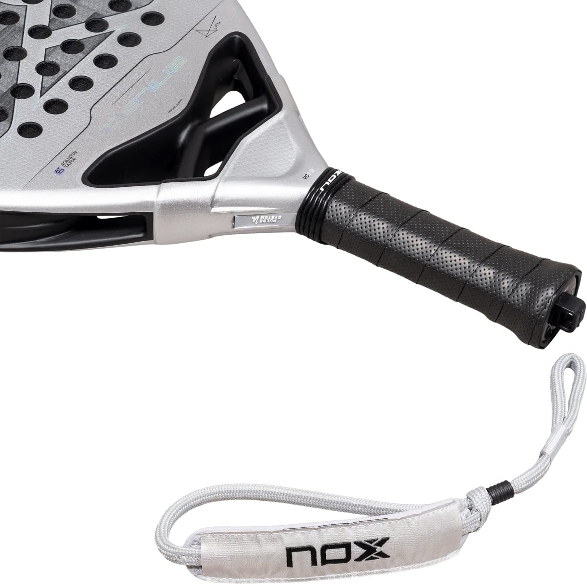 Silver NOX AT10 Genius 12K Alum Xtrem By Agustín Tapia 2027 padel racket with a black perforated grip and a matching wrist strap featuring a logo.