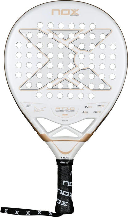 White NOX AT10 Genius Junior 2026 padel racket with a circular head, a perforated face featuring an X-shaped pattern, and a black handle with a wrist strap.