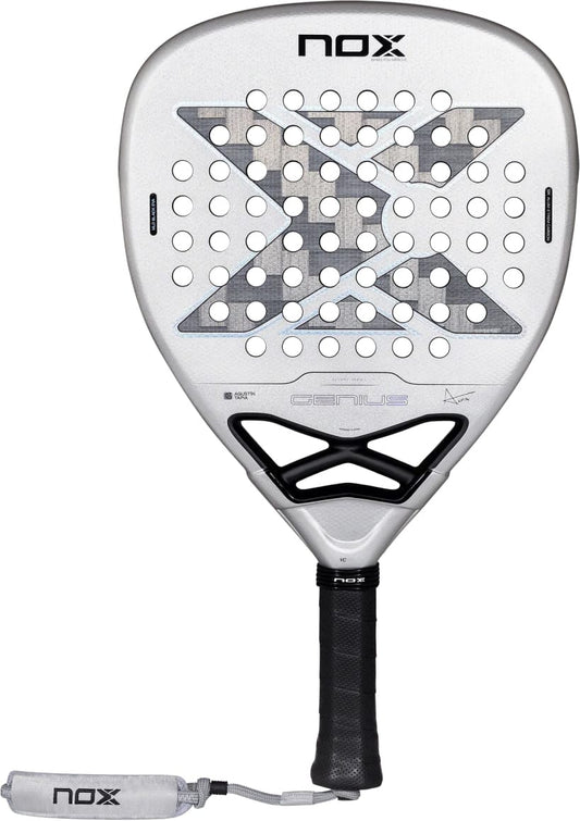 Silver diamond-shaped NOX AT10 Genius Attack 12K Alum Xtrem By Agustín Tapia 2027 padel racket with a central X pattern, circular perforations, and a black handle with a wrist strap.