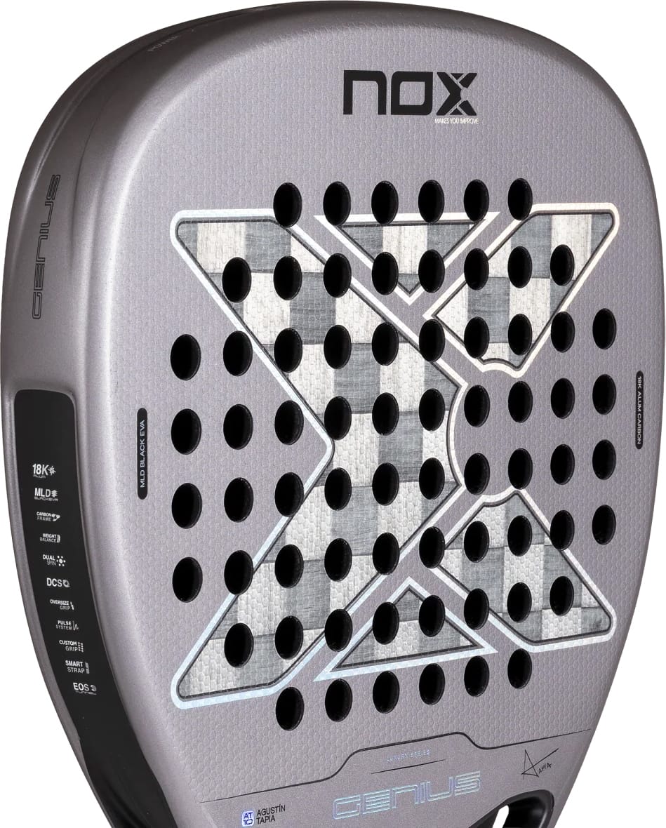 Grey NOX AT10 Genius Attack 18K Alum By Agustín Tapia 2027 Padel Racket with a diamond-shaped grid of holes, a large X pattern in the center, and technical specification text along the side.